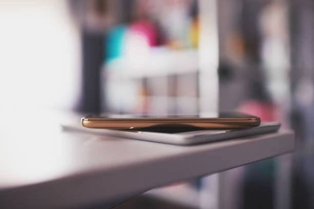 istock Digital tablet and phone on desk in modern home office 1084370506