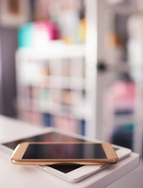 istock Digital tablet and phone on desk in modern home office 1084370510