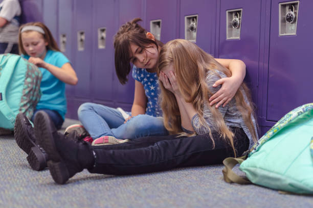 istock A friend consoling her friend at an elementary school 1084370782