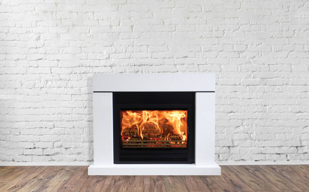 istock White Fireplace in bright empty living room interior of house 1084372228