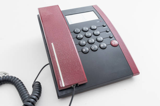 istock office telephone isolated on a white background 1084376106