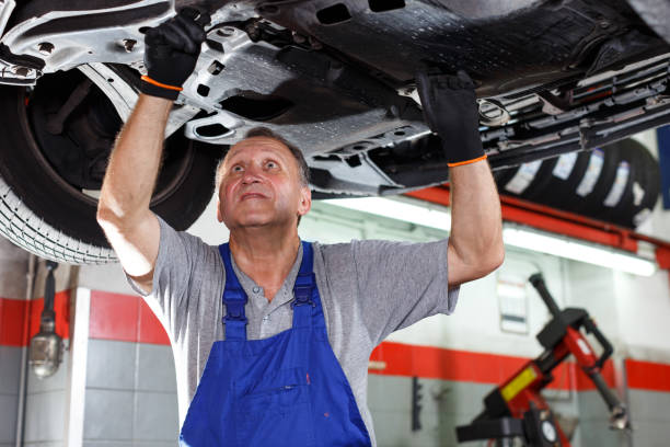 istock Mechanic engaged in car repair 1084382724