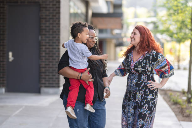 istock Female couple walking with their son 1084383588