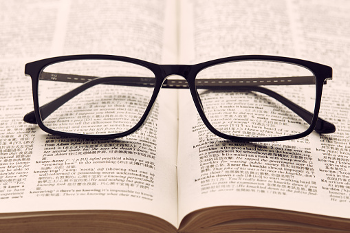 Reading glasses on a book