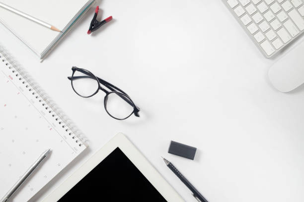 istock Office supplies, Glasses at a desk with a computer keyboard , business concept 1084386594