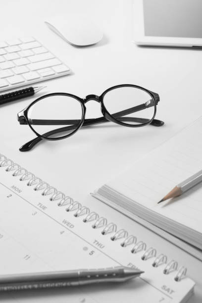 istock Office supplies, Glasses at a desk with a computer keyboard , business concept 1084386596