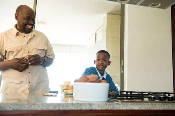 istock Grandfather bonding with grandson at home 1084387948
