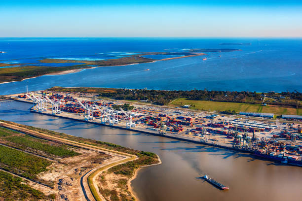 Morgan's Point - The Port of Houston Houston, United States - December 10, 2018:  A line of cargo container and tanker ships sailing across Trinity Bay from the Gulf of Mexico making way for the Port of Houston or the various refineries located north along the San Jacinto Bay or the Buffalo Bayou.  The image was shot from an altitude of about 2000 feet. newfoundland and labrador photos stock pictures, royalty-free photos & images