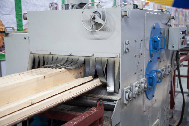 istock Big industrial sawmill cutting wood into boards 1084396536