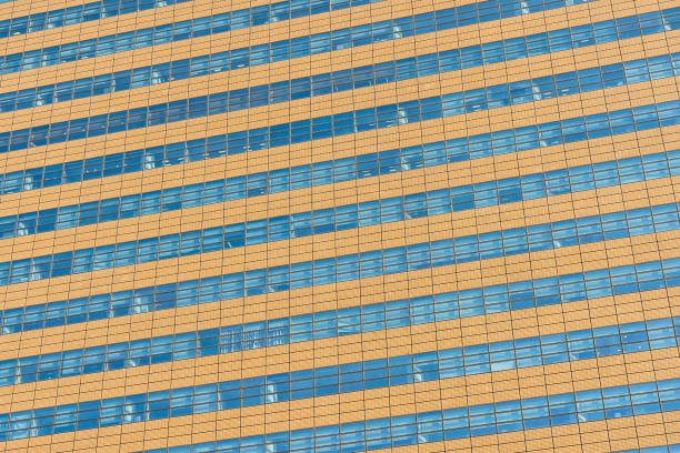 istock Beautiful architecture office building with glass window textures 1084398120