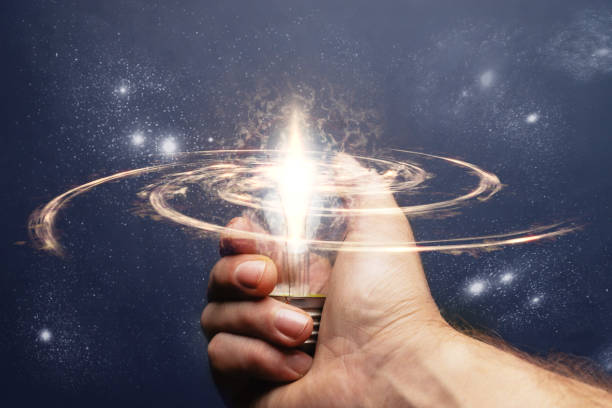 istock Businessman hand holding a light bulb with Innovative ideas. 1084399442