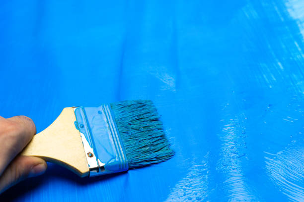 istock Brush for paints on a beautiful blue background. 1084400124