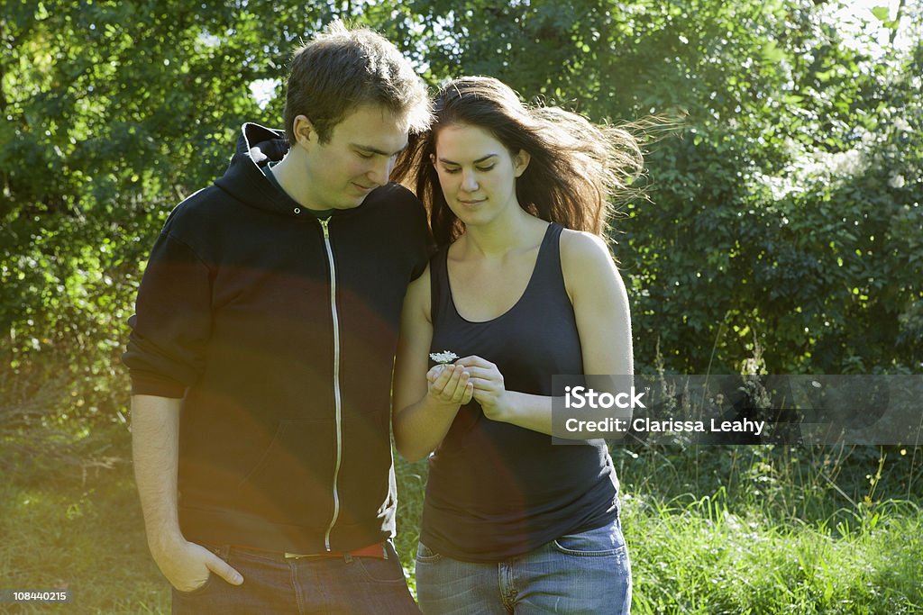 Couple looking at flower Battersea, London, UK 20-24 Years Stock Photo