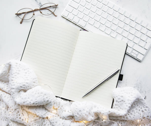 istock Notebook, keyboard, scarf and garland 1084406312