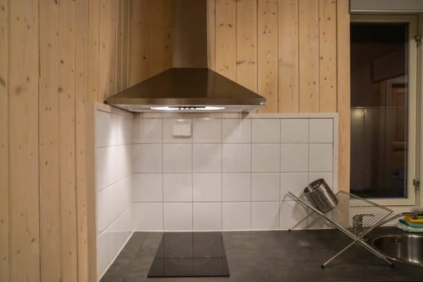 istock cooker hood with electric stove in modern kitchen 1084406736