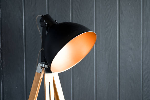 istock Black lamp shade on gray wall background. Modern living room 1084411574