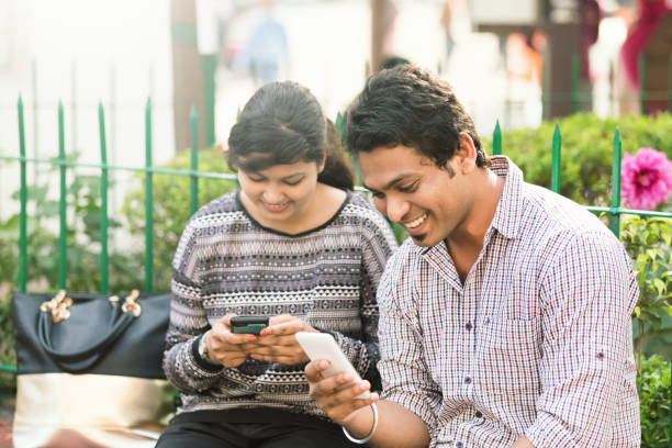 istock Young people in India using mobile phone 1084415638