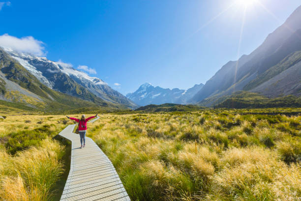 Asian woman enjoy travel at mount cook national park in south Island New Zealand stock photo