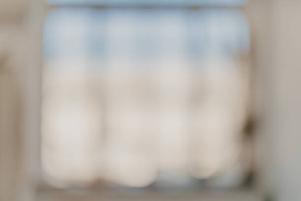 blurred bright room background with big window