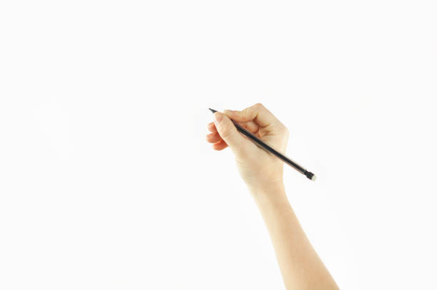 istock Girl's hand writes in empty space isolated on background 1084421802