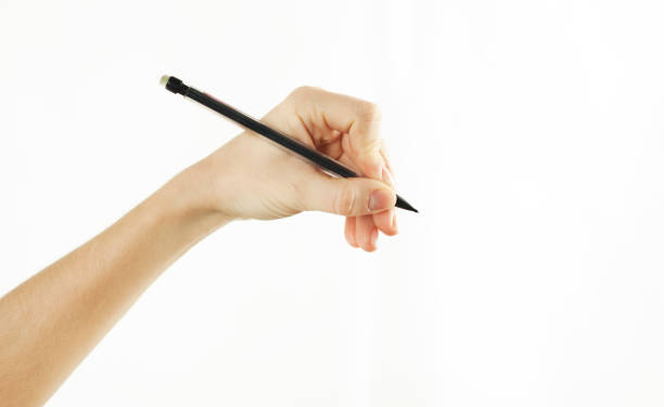 istock Girl's hand writes in empty space isolated on background 1084421838