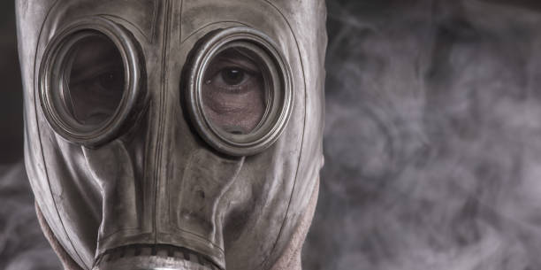 istock man in gas mask in smoke 1084423408