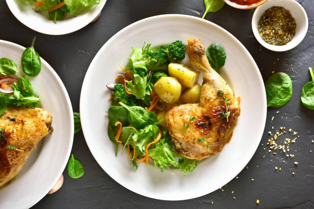istock Roasted chicken leg with potato 1084435704