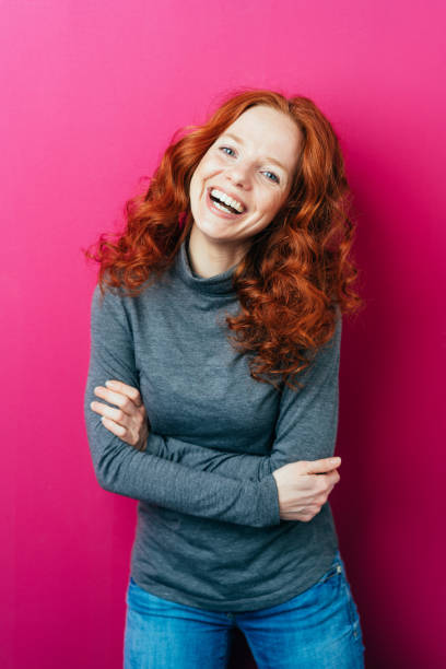 istock Young redhead woman with a vivacious smile 1084437892