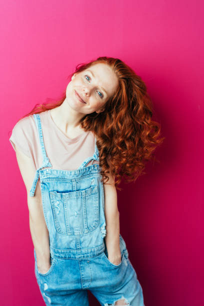 istock Young cheerful woman wearing overalls 1084440544