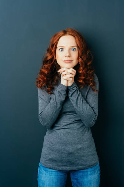 istock Eager excited young redhead woman 1084440668