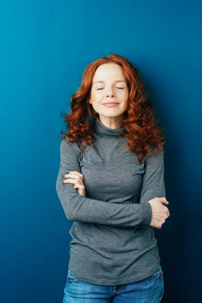 istock Happy serene young woman with a blissful smile 1084441190