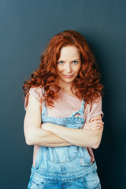 istock Speculative young woman staring intently at camera 1084444052