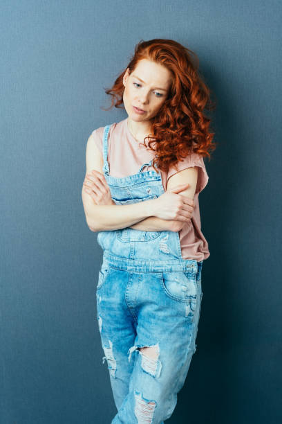 istock Thoughtful sad young woman with a melancholy look 1084445320