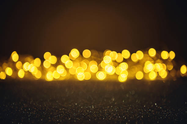 istock selective focus of blurred sparkling lights and bokeh on black 1084447966