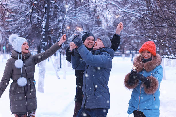 istock group of young people with sparklers on holidays 1084447968