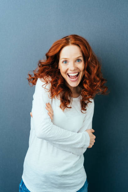 istock Vivacious young woman with a beaming smile 1084448872