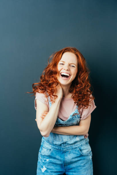 istock Happy vivacious young woman having a good laugh 1084450154
