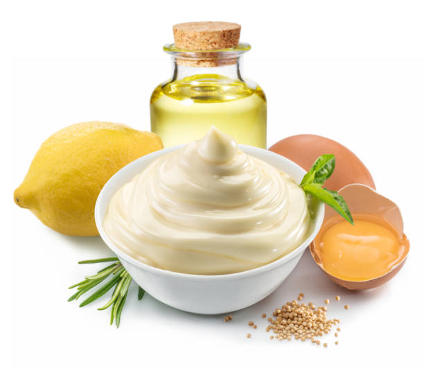 istock Mayonnaise sauce in white bowl with mayonnaise ingredients. 1084452726
