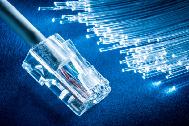 istock Network cable and optical fibers with lights. 1084455552