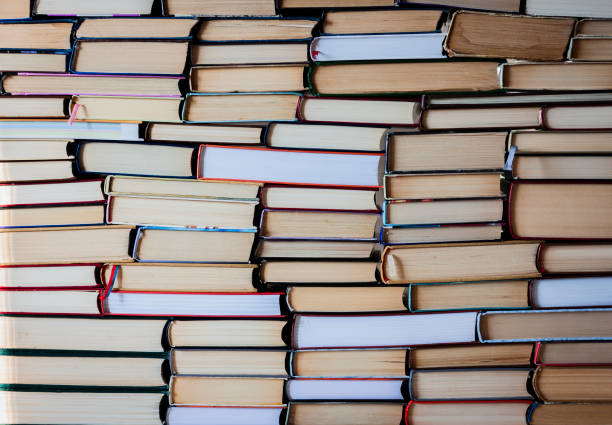 istock Stack of books education background, many books piles with copy space for text 1084457794