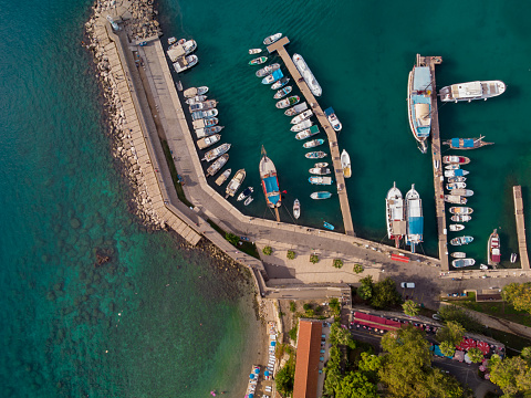 Greece, Bourtzi, Venetian water fortress at the entrance of Nafplio harbour. Aerial drone view. Blue sky, rippled sea background.