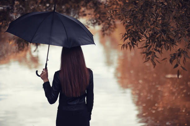 istock Young girl in autumn park 1084462090