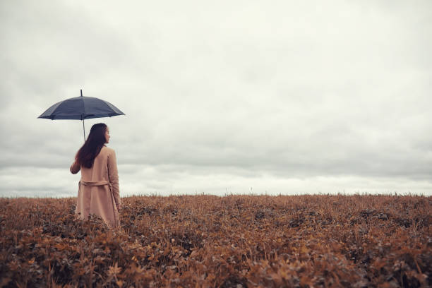 istock Young girl in autumn park 1084466896