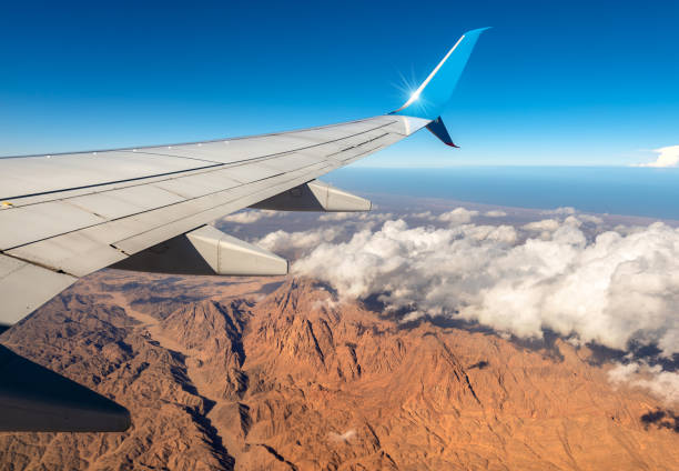 Aerial view of the Sahara desert and the Red Sea with an aircraft wing, Egypt, Africa.