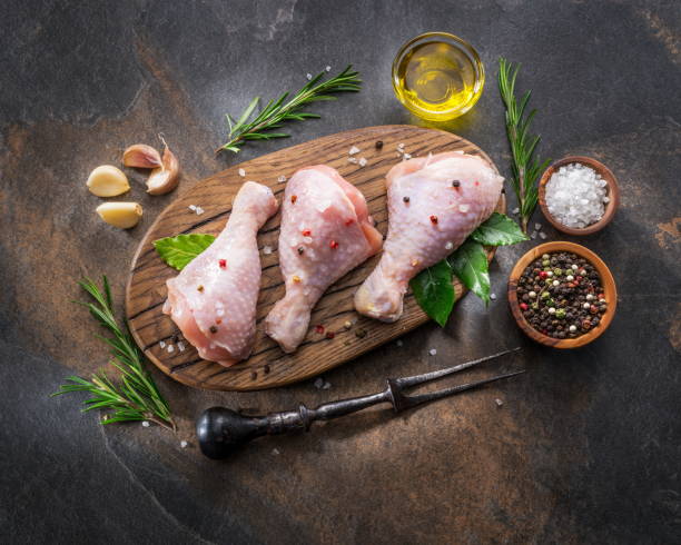 istock Chicken legs with spices and salt  ready for cooking. 1084470770