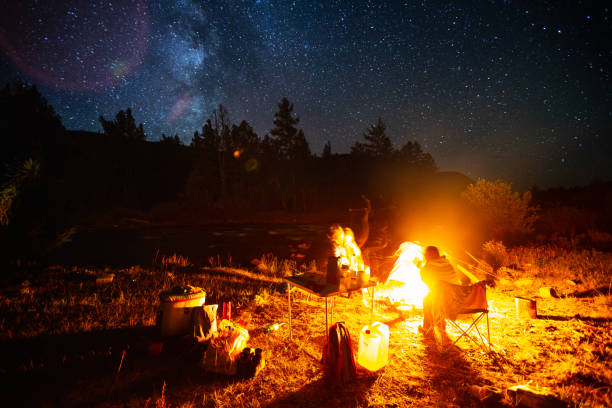 istock Tourists sit near the fire 1084471452