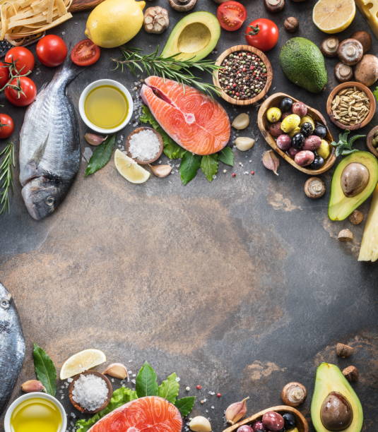 istock Raw dorado fish and salmon steak with spices and vegetables. 1084471486