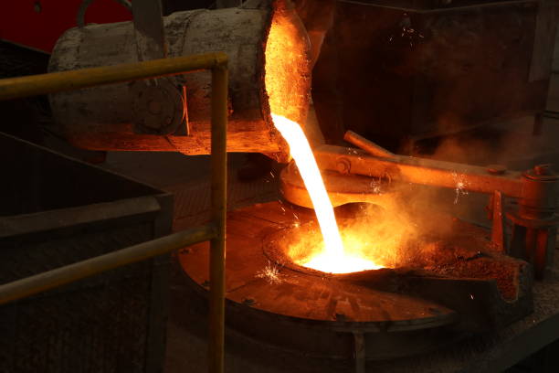 istock Molten iron pour from ladle into melting furnace 1084476374