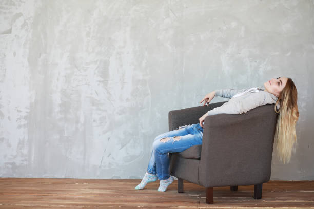 istock A young girl rests in a cozy room 1084477068