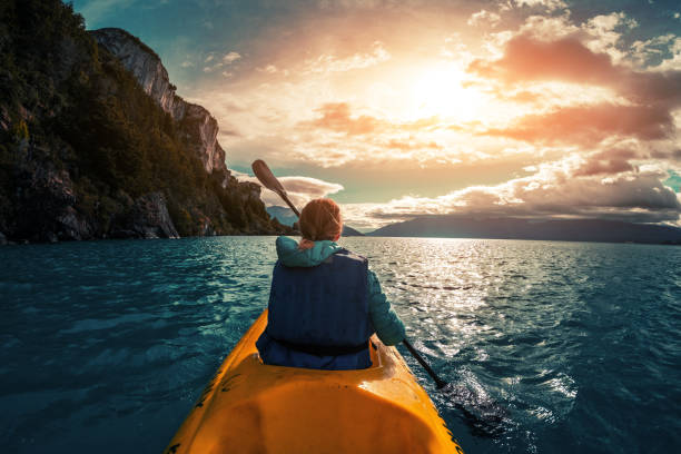istock Woman paddles kayak 1084477080
